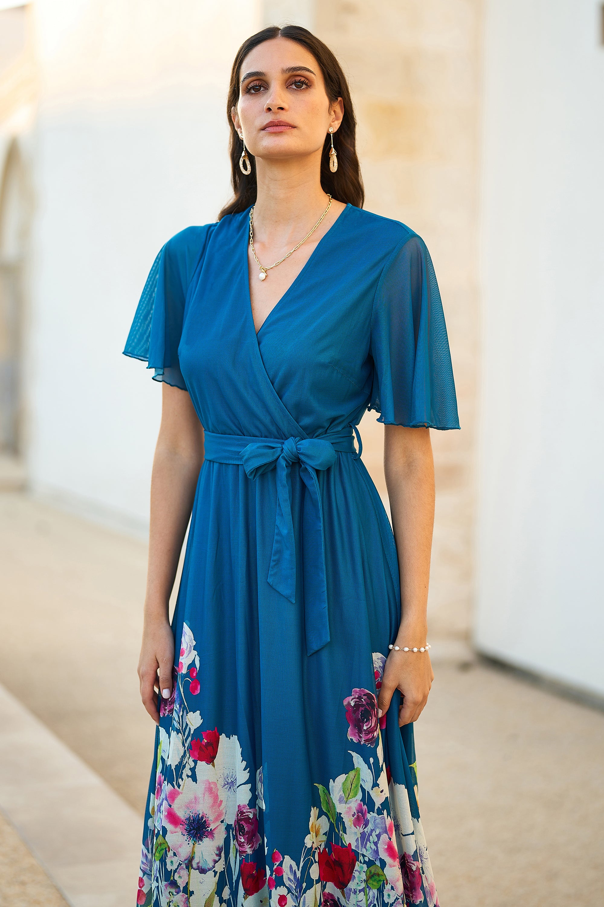 Yumi Teal Mesh Wrap Midi Dress With Floral Hem Border - Image 4